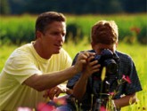 Father and son with a camera