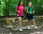 Young girls walking a dog