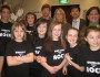 Eco-Schools USA staff shown with Whitelees School of Rock musicians and music director
