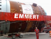 Activist and Executive Director of Honor the Earth Winona LaDuke stands in front of one of the monstrous loads of machinery.