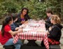 First Lady Michelle Obama participates in a student reporter roundtable with Gabriel Roy, Time for Kids, Helen Onufer, National Geographic for Kids, Alexandria Zhang, Scholastic, Daniel Symons, Ranger Rick in the Children's Garden of the White House, March 16, 2011. (Official White House Photo by Chuck Kennedy)