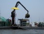 Scraping oiled marsh in Louisiana's Bay Jimmy, April 2011