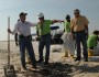 Secretary of the Interior Ken Salazar helps volunteers clean up oil damage to beach at Gulf Islands National Seashore (photo: Tami A. Heilmann-DOI)