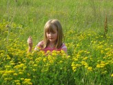 My daughter enjoying nature in our backyard