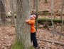 Child hugging tree, North Carolina