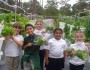 Students of Pine Jog Elementary, a U.S. Green Ribbon and NWF Eco-School, hold up lettuce from their hydroponic garden.