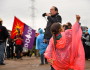 Clayton Thomas-Muller, one of the main organizers, gathers the marchers. Photo copyright Alexis Bonogofsky