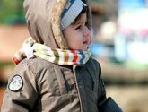 Little Boy Bundled Upon Playground