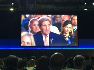 Delegates watch as Secretary Kerry voices U.S. support for the Paris Agreement. Photo by David Burns