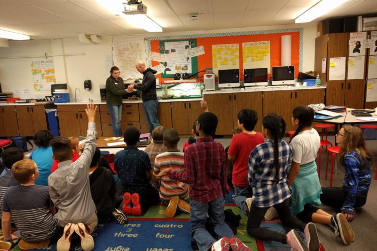 AmeriCorps member, Molly Orr, delivering salmon eggs to an Oregon classroom. Photo by Barnes Elementary School