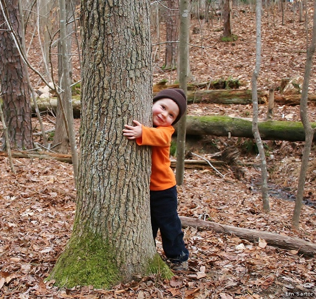 Child hugging tree, North Carolina