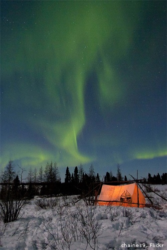 Aurora borealis over a campsite