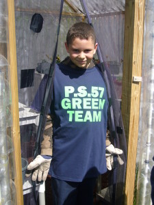 PS 57 5th grader in the greenhouse.