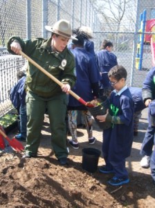 PS 57 Earth Day - boy with ranger and dirt