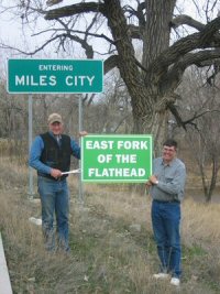 Ranchers Mark Fix and Brad Sauer hold up East Fork of the Flathead sign in 2010. 