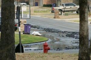 Tar sands gushes into Arkansas neighborhood street after pipeline ruptures.
