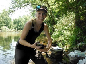 The author, pictured here holding a hellbender salamander. 