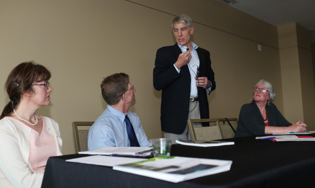 Sen. Mark Udall stands as he talks to (from left) Leigh Welling, David Anderson and Ann Morgan during a panel discussion on climate change. NWF Photo