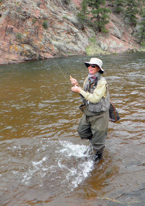 Chris Crosby plays a trout caught on Colorado's South Platte river May 20. Photo by Russell Bassett