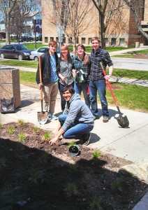 Friends and students plant native plants at campus library. Photo Credit: Steve Woltmann