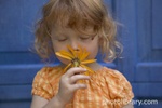girl_smelling_flower_photolibrarycom_150x100