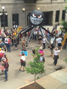 Protesters in St. Paul, MN object to Enbridge plans to expand tar sands transport through the region. Photo by Jim Murphy