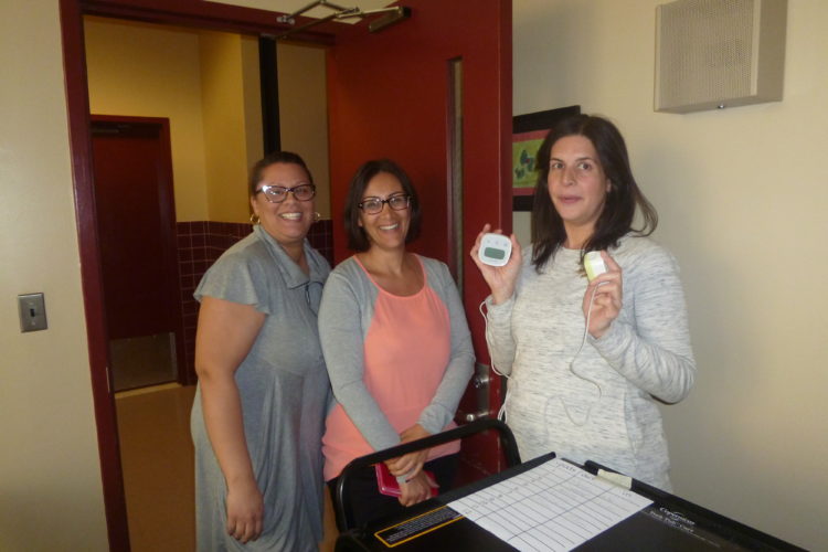 Teachers at PS 110 measure energy consumption in appliances. Photo by NWF.