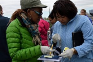 Teachers work in teams to test Hudson River water for turbidity. Photo by Teri Brennan