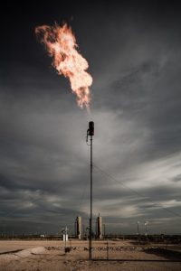 Methane is flared at an oil and gas development site. Photo by Blake Thornberry