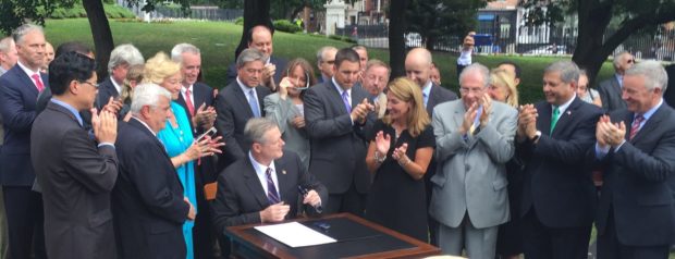 Governor Baker signs the bill! Photo by NWF