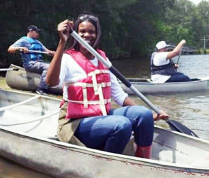 Educator Donelle Williams on a canoe
