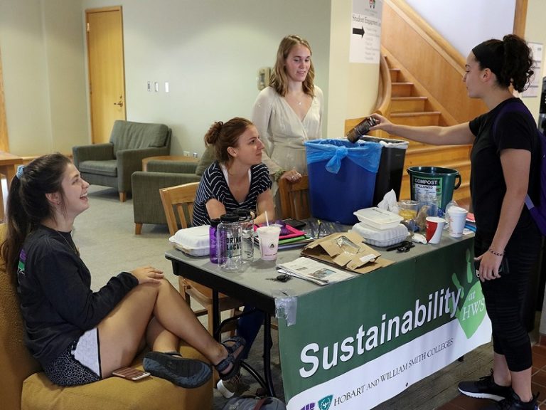 sustainability students at an information desk