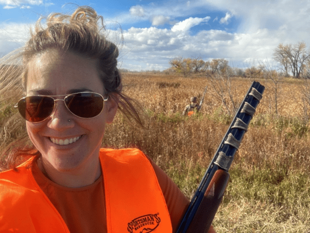 Naomi Alhadeff enjoying a moment in the sun while upland bird hunting in Montana.
