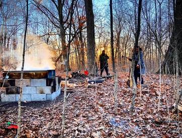 Volunteers camp on-site, tap maple trees, and boil the sap over a fire.