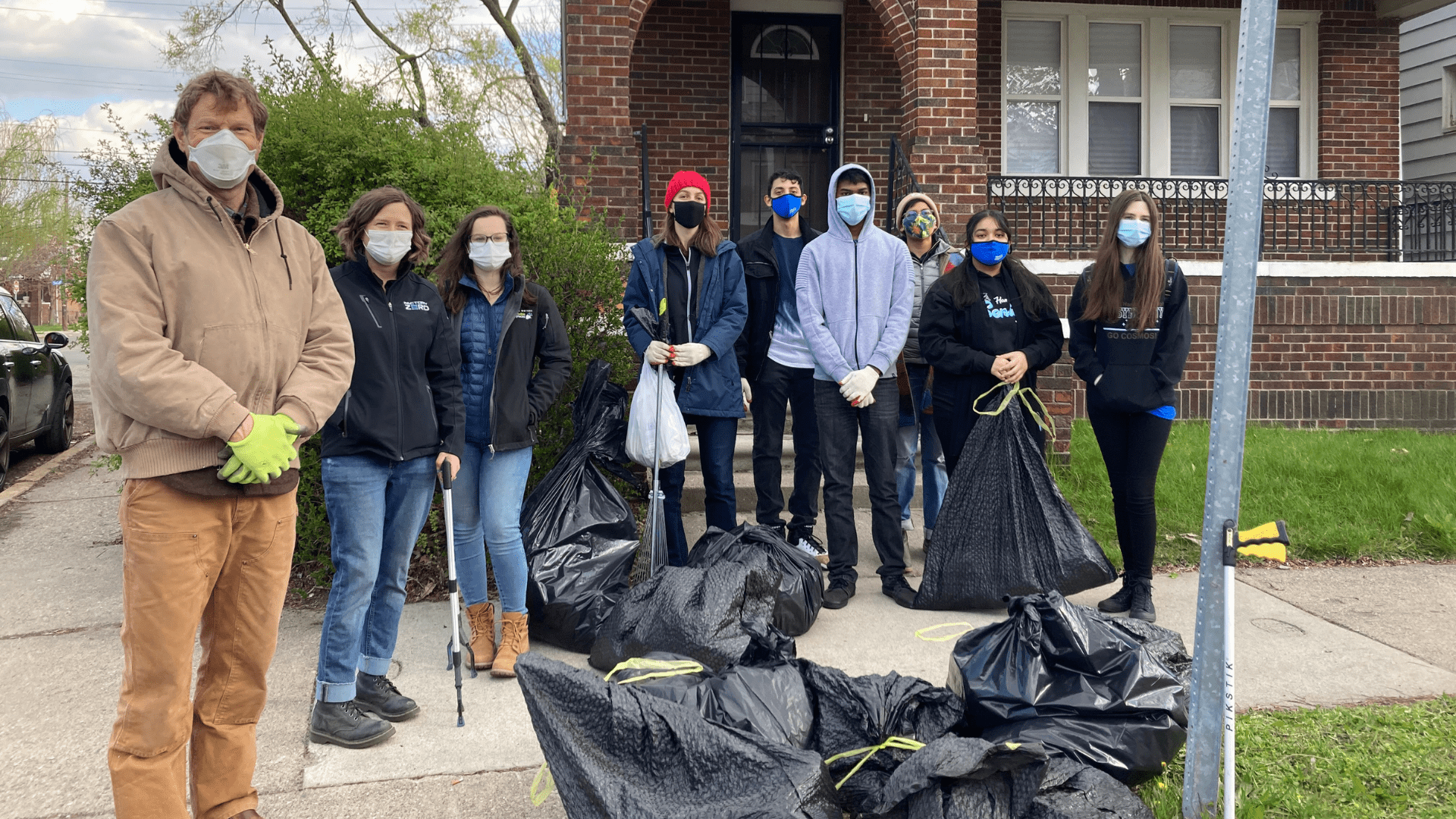 group outdoors conducting a community cleanup