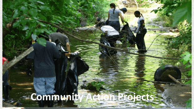 students participating in river clean up