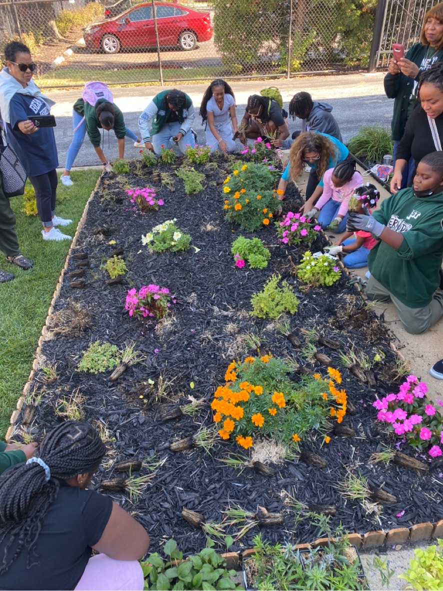 Volunteers at Bethel Bethel African Methodist Episcopal Church (Bethel AME) surround their native pollinator garden.  
