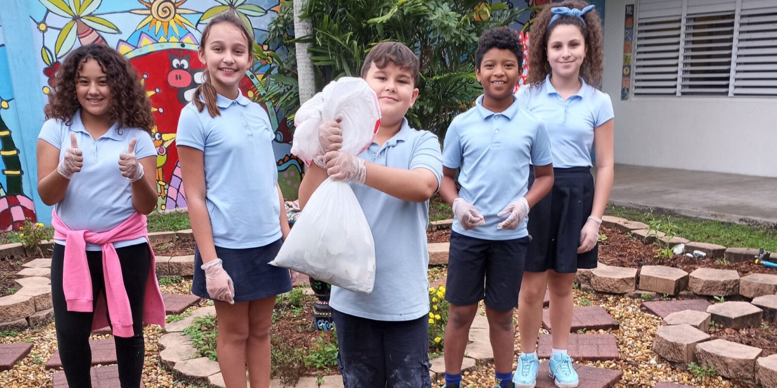 students collecting trash