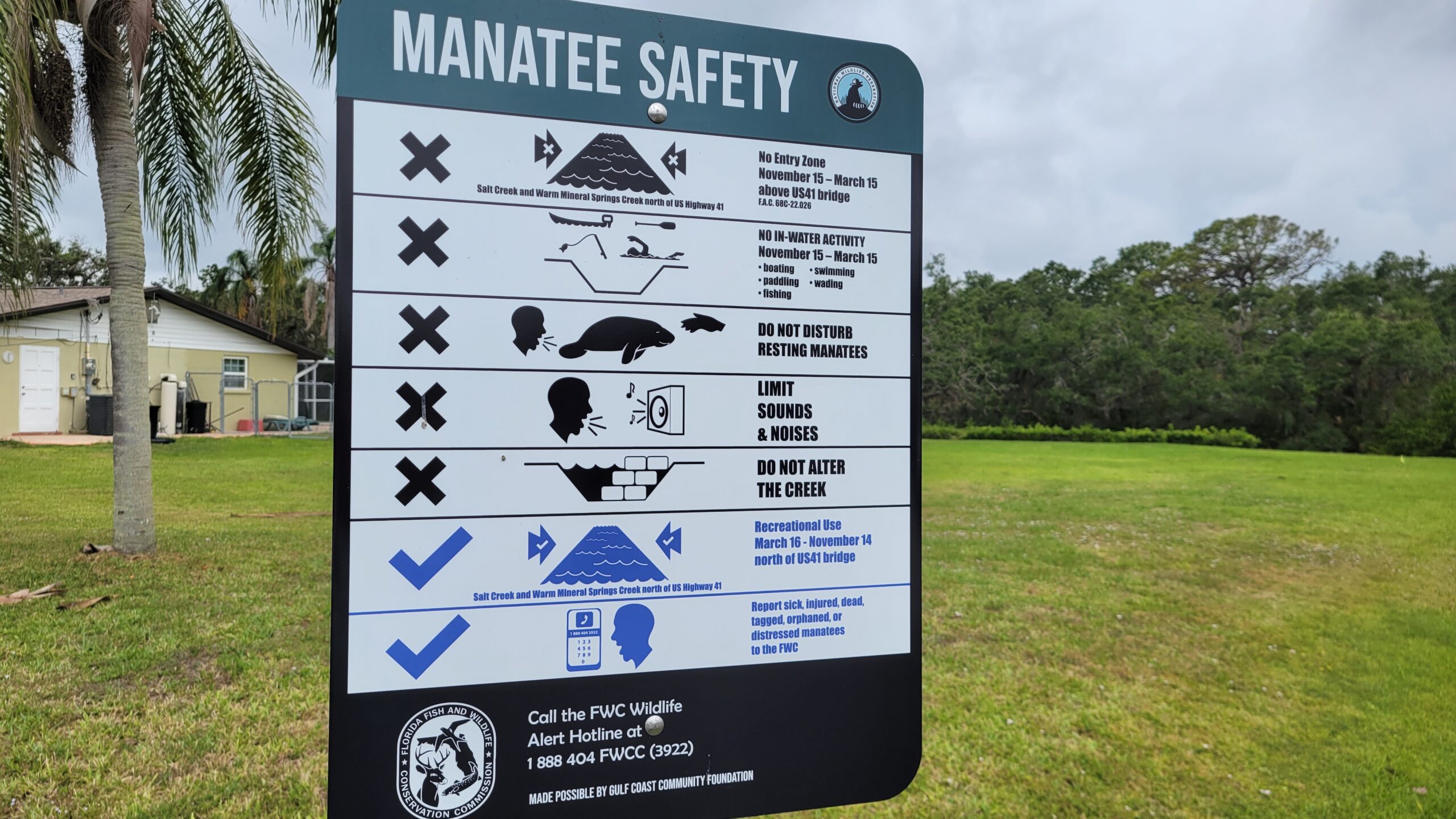 A sign detailing manatee safety.
