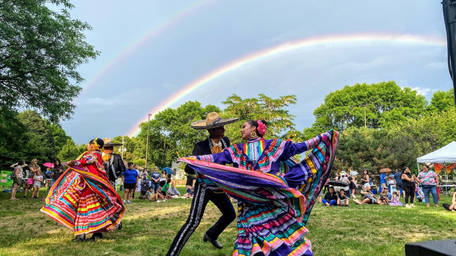 Mexican ballet Folklόrico dancers beneath a rainbow at the 2022 Columbia Heights Bilingual Monarch Festival. Credit: Mayor Amáda Márquez Simula
