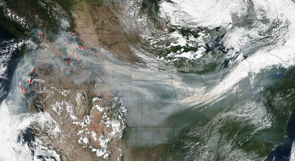 A satellite map view of wildfire smoke travelling across North America.