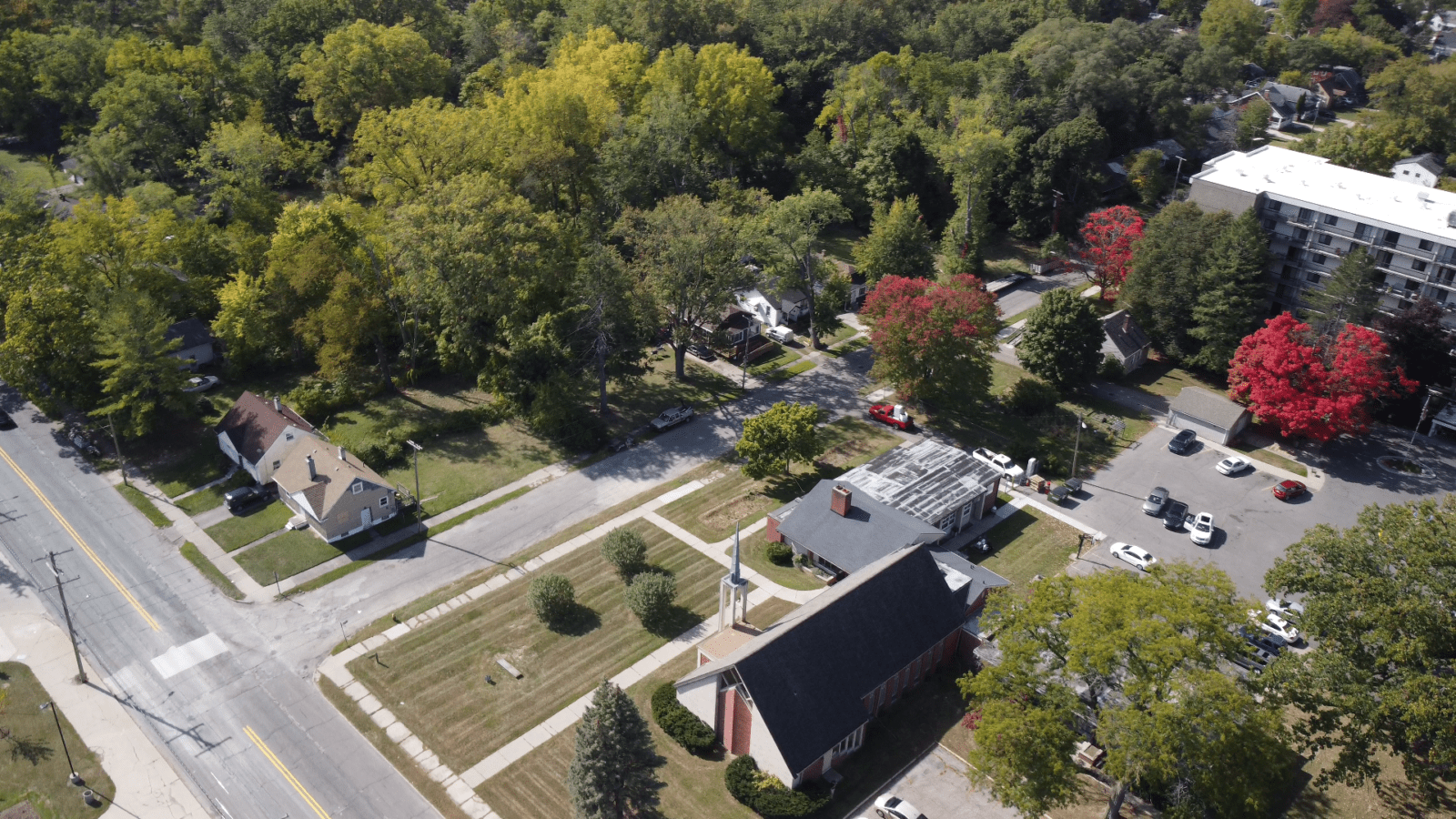 Aerial view of a street corner featuring a church building.
