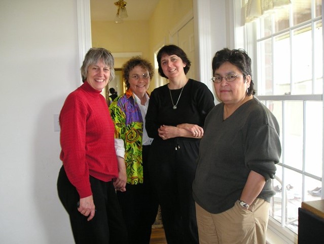 Four people pose for a photo.