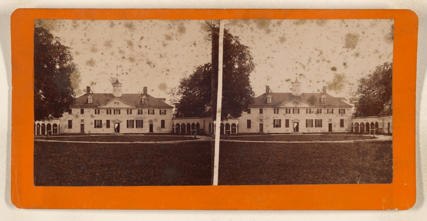 Old sepia photograph showing a large house sitting on a well-kept lawn.