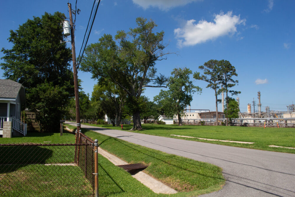 A residential neighborhood is situated near a power plant.